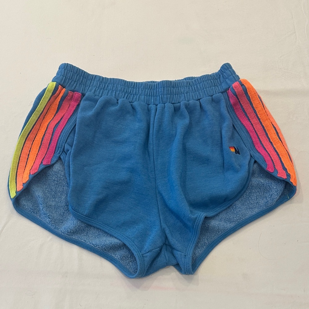 Aviator Nation women’s blue shorts size M with Rainbow neon Stripes.